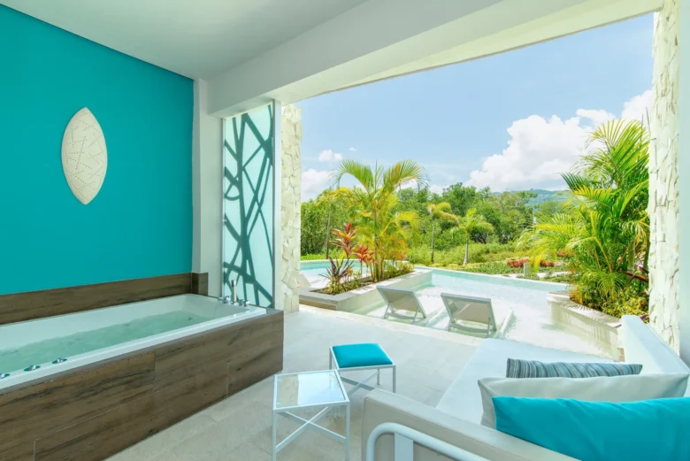Swim Out terrace of the Xhale Club Junior Suite at Breathless Montego Bay with private pool access, lounge seating, and lush tropical landscaping.