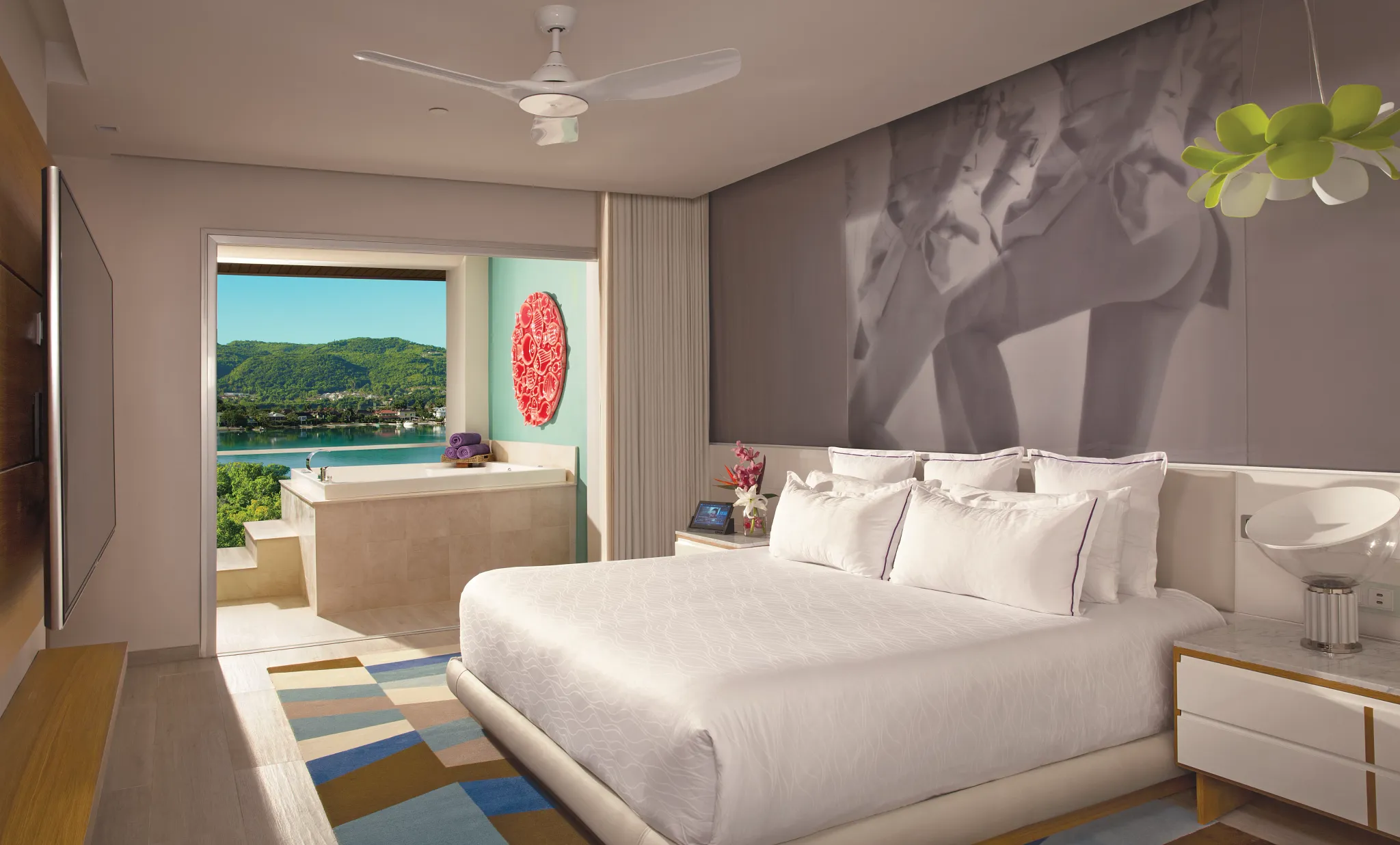 Xhale Club Master Suite Ocean View bedroom at Breathless Montego Bay with king bed, modern décor, and private Jacuzzi overlooking Montego Bay.